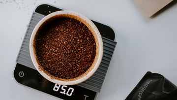 85 grams of ground coffee on a digital scale