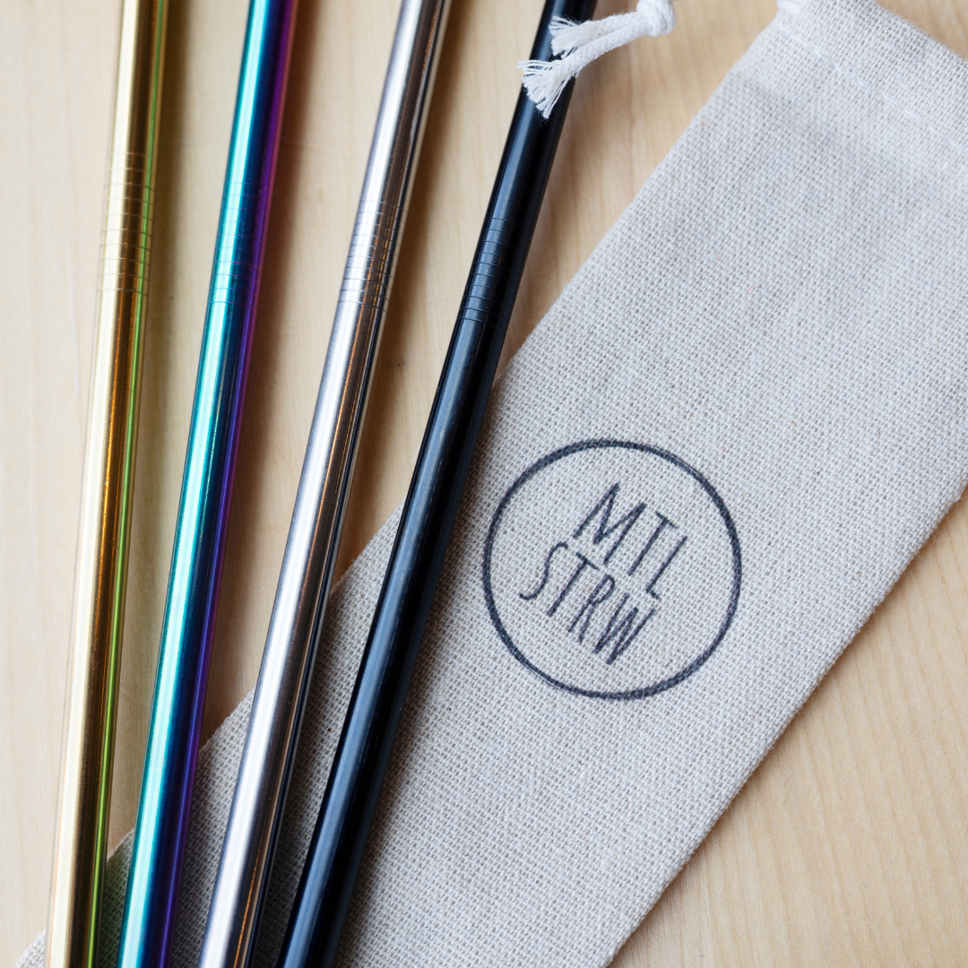 Metal straws with a MTL branded carrying pouch on a wooden surface