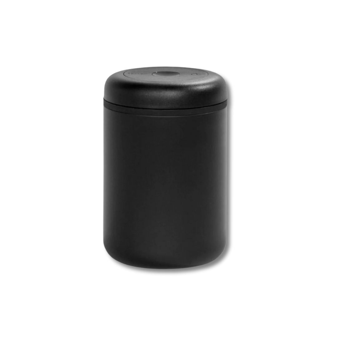 Black cylindrical container with lid on a white background