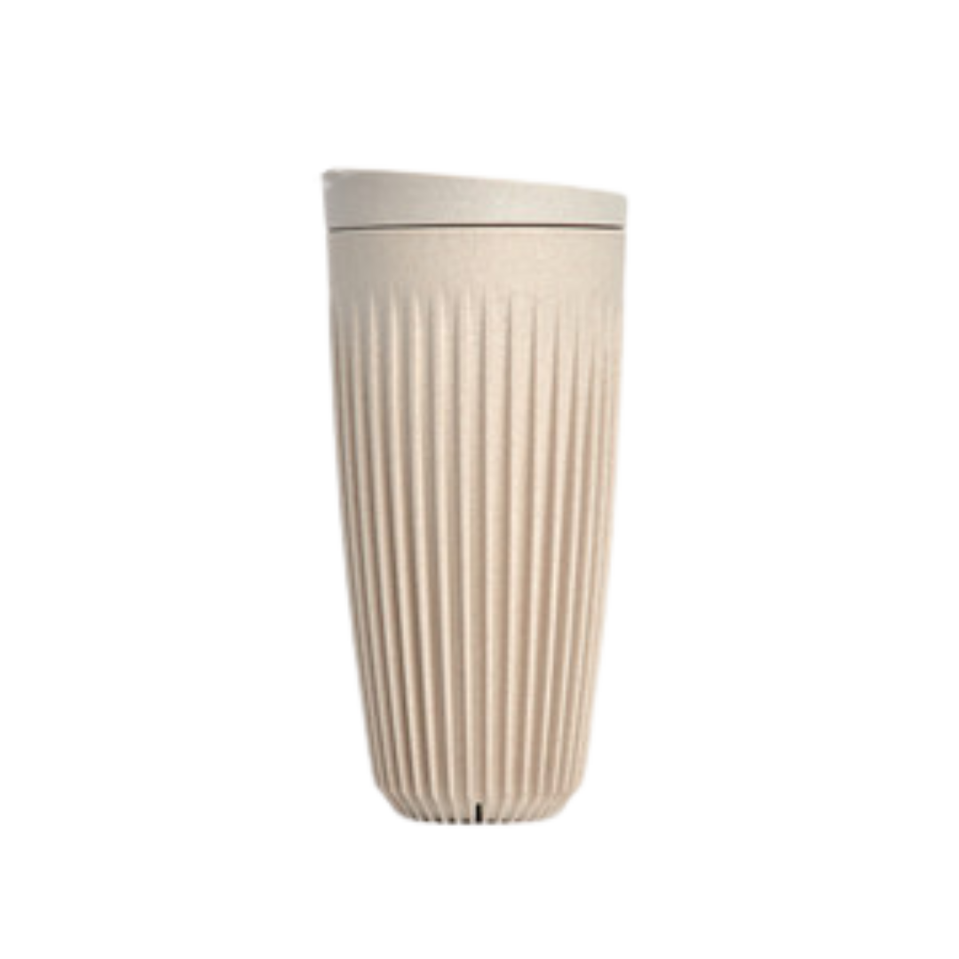 Cream coloured cup and lid.