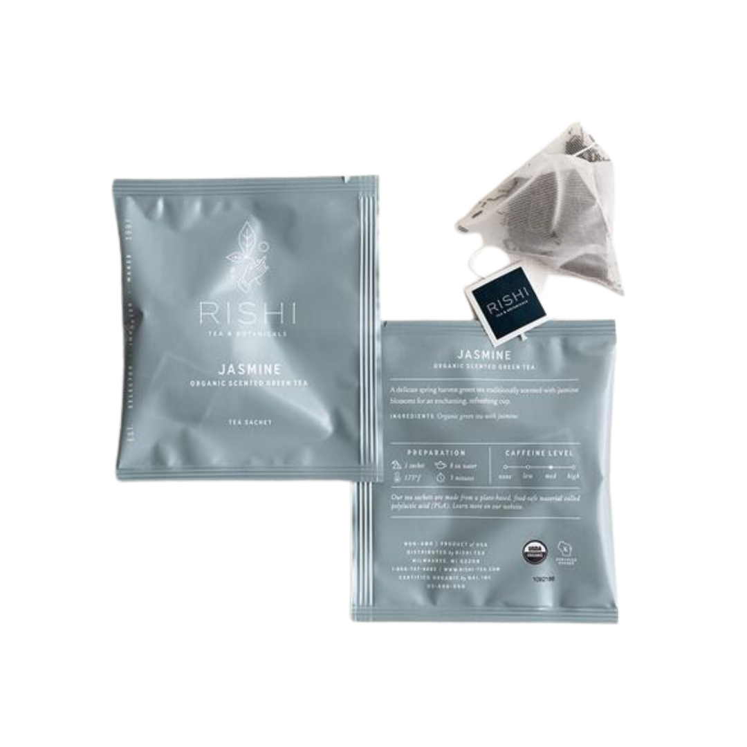Jasmine green tea packages and a tea bag from Rishi Tea
