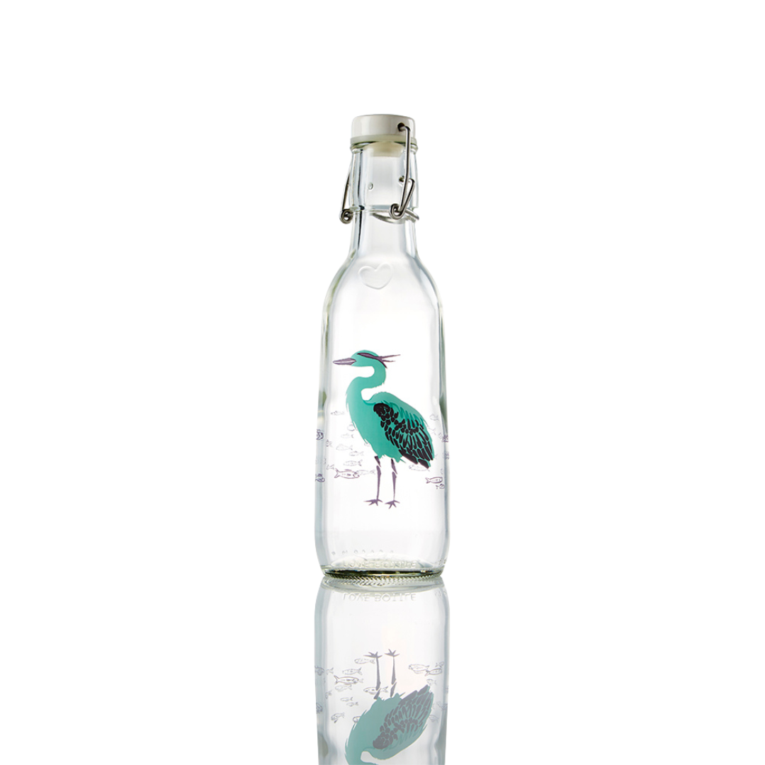 Glass bottle with a heron design on it.