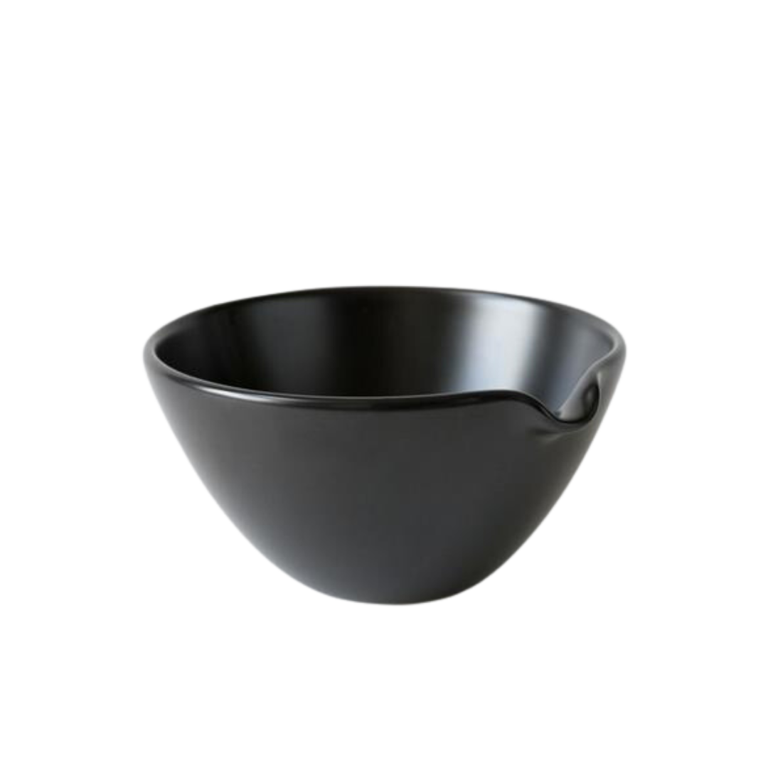 Black matcha pouring bowl with a spout.