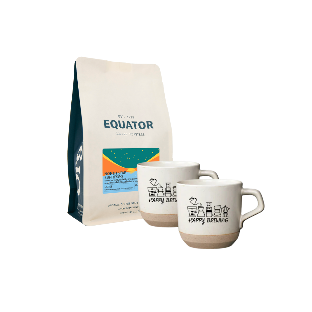 Two white Kinto ceramic mugs with a bag of Equator coffee.