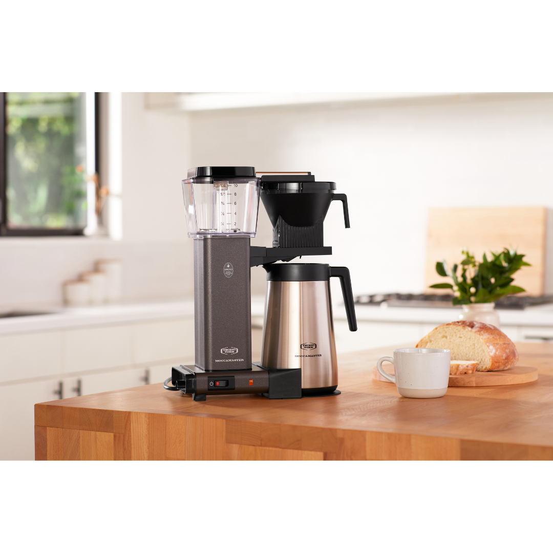 The stone grey Moccamaster on a kitchen counter.