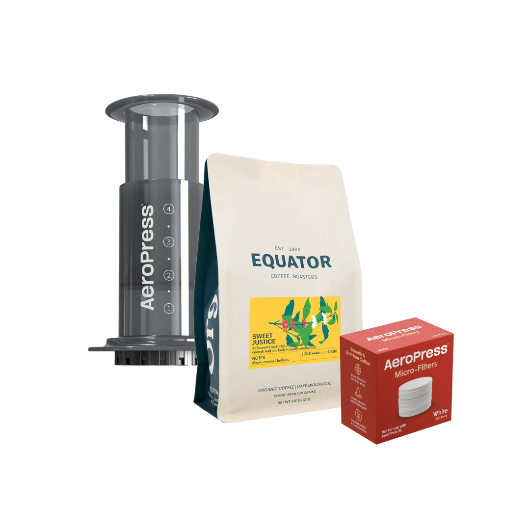 AeroPress coffeemaker with a bag of Sweet Justice and a box of filters.