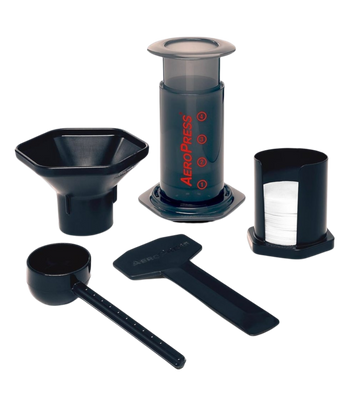 Shows all the parts that come with the Aeropress Coffee Maker. Funnel, spoon, filters and filter holder, stirrer and the Aeropress Maker.