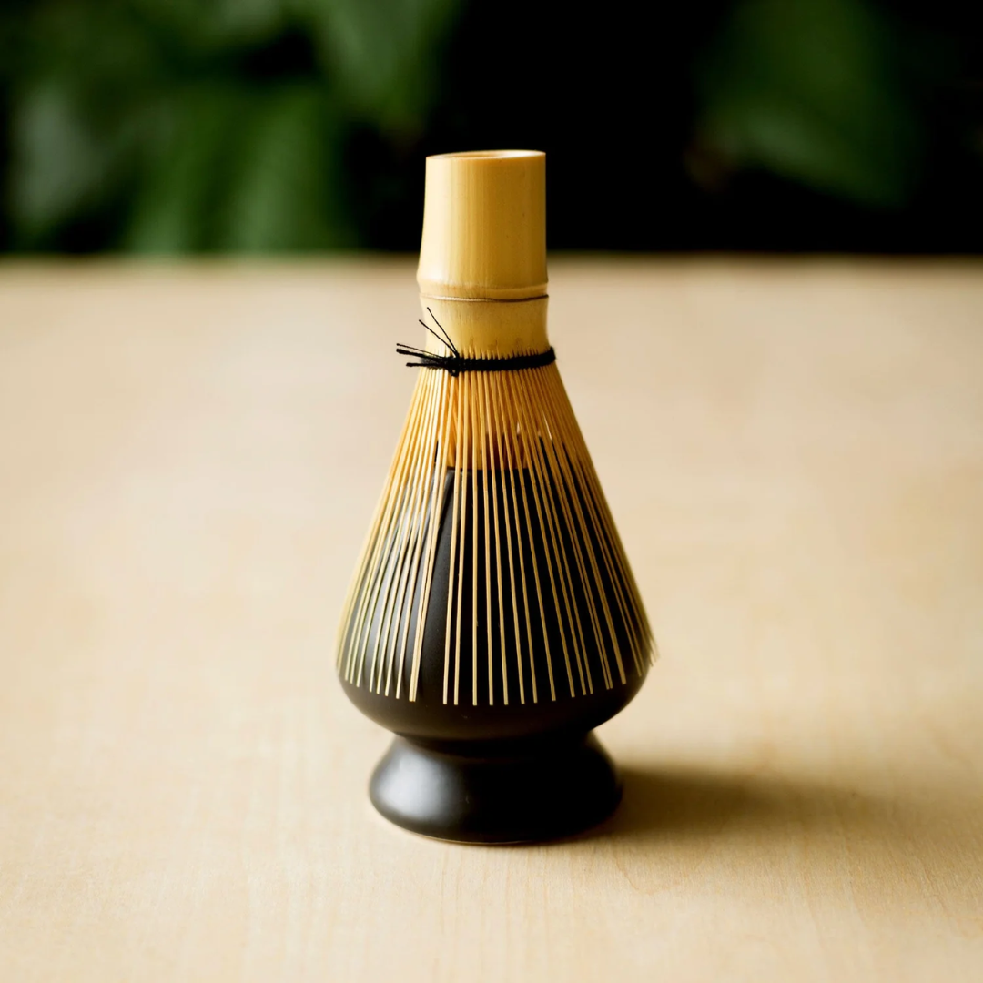 Bamboo whisk on a black chasen