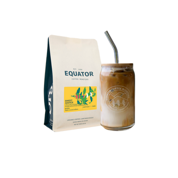 Bag of Sweet Justice and a glass of cold brew coffee with lid and straw.