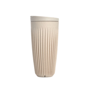 Cream coloured cup and lid.