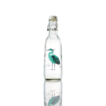 Glass bottle with a heron design on it.