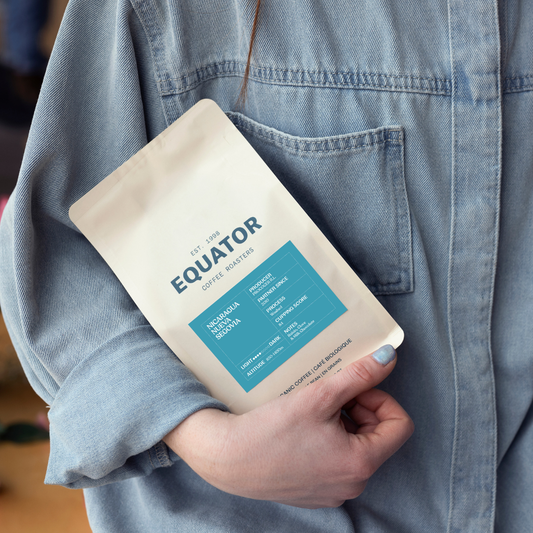 Person holding a bag of Nicaragua Nueva Segovia single origin coffee.