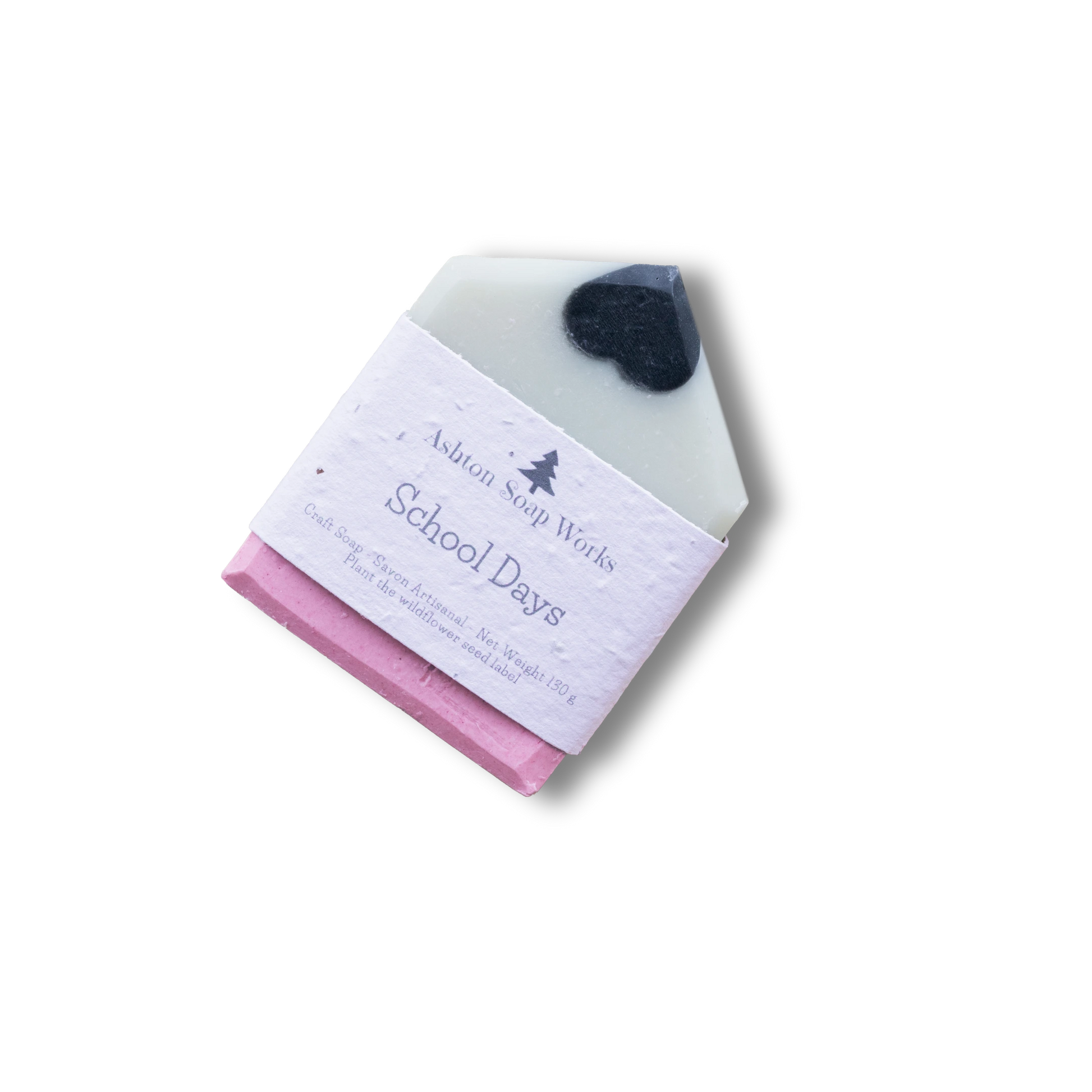 A pencil-shaped soap bar wrapped in a white paper label that reads 'Ashton Soap Works School Days'. The soap looks like a pencil - Equator Coffee Roasters