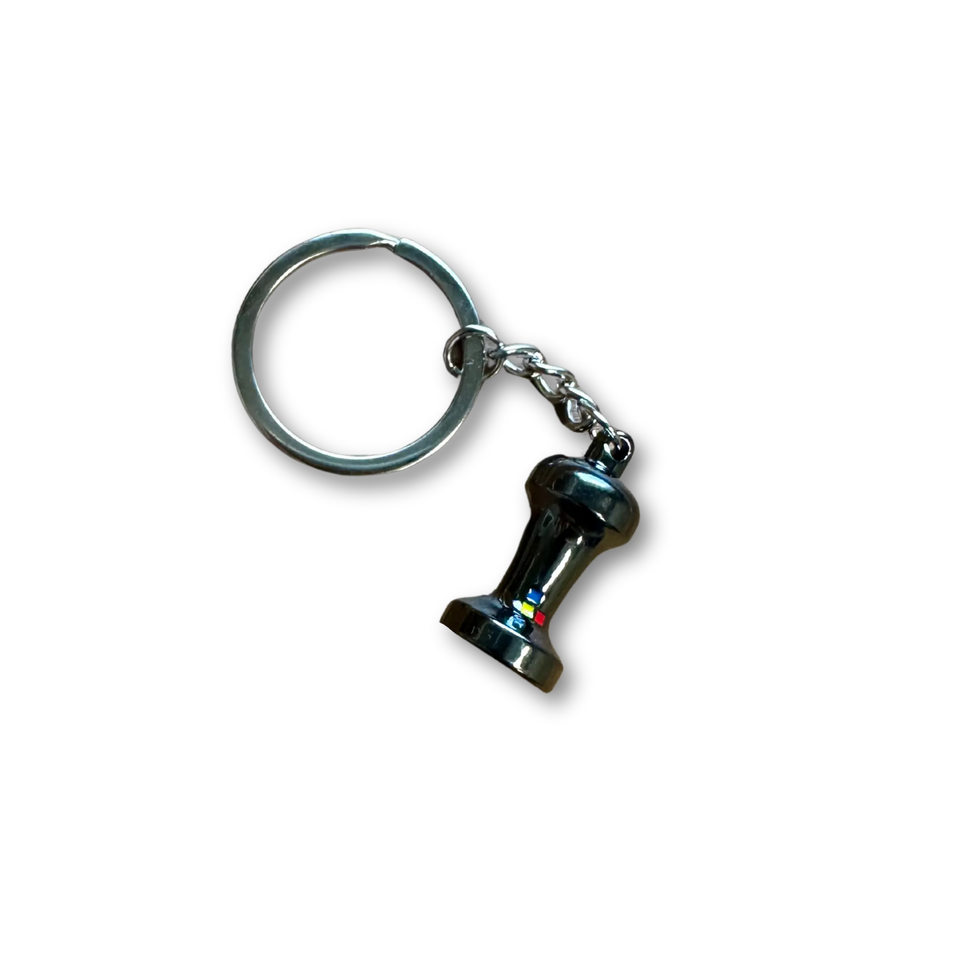 A silver medal keychain with a small replica espresso tamper.
