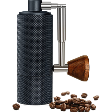 Hand grinder with coffee beans.