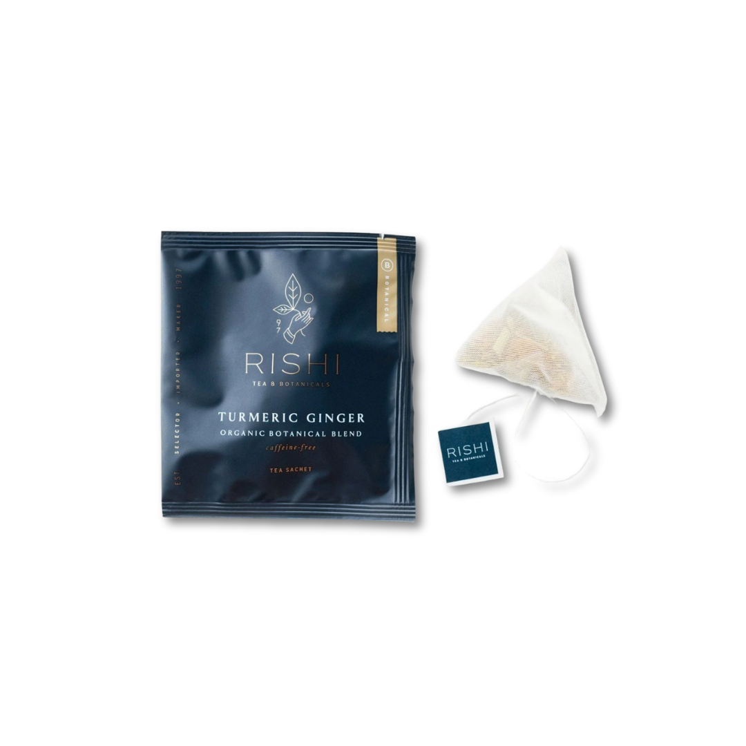 Rishi Turmeric Ginger tea package with tea bag beside it
