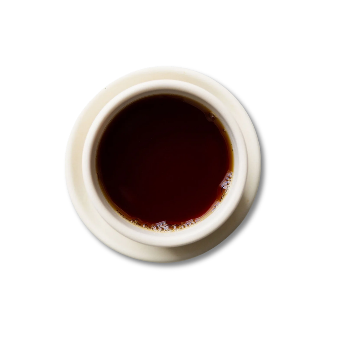 White teacup with steeped Wild Thai Black tea.