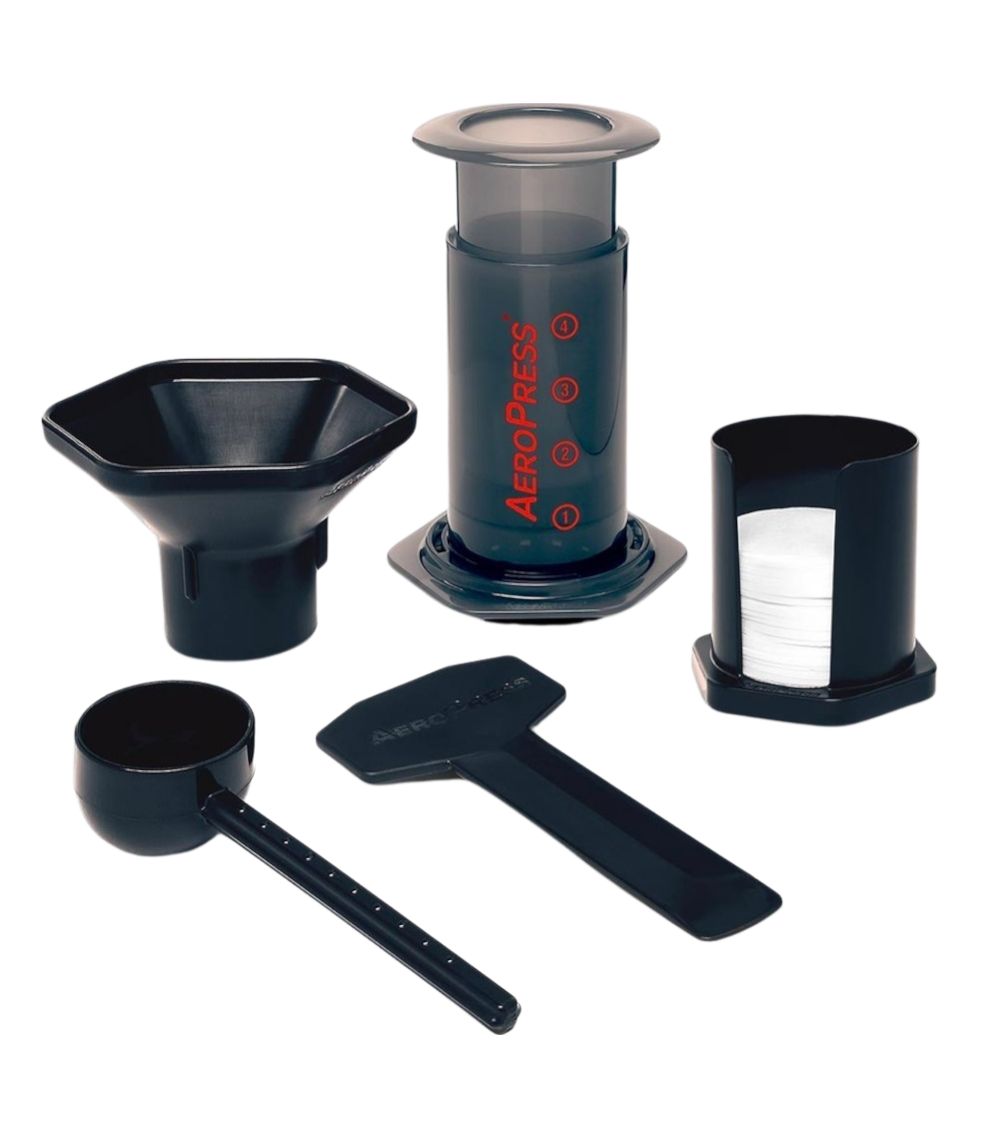 Shows all the parts that come with the Aeropress Coffee Maker. Funnel, spoon, filters and filter holder, stirrer and the Aeropress Maker.