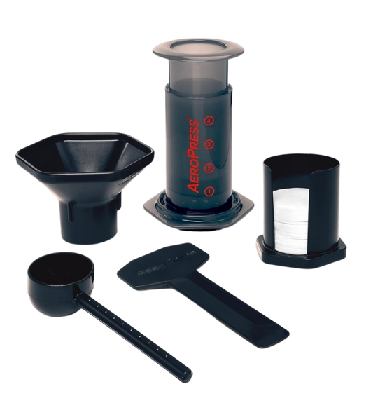 Shows all the parts that come with the Aeropress Coffee Maker. Funnel, spoon, filters and filter holder, stirrer and the Aeropress Maker.
