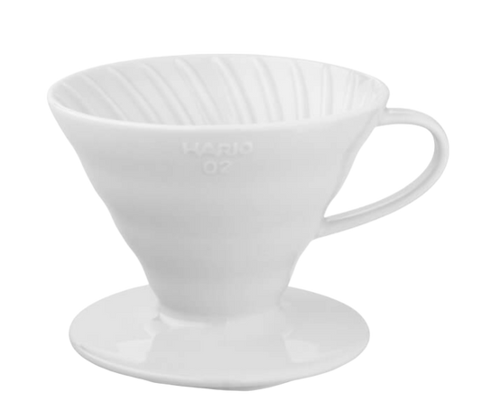 White ceramic Hario V60-02 coffee dripper.