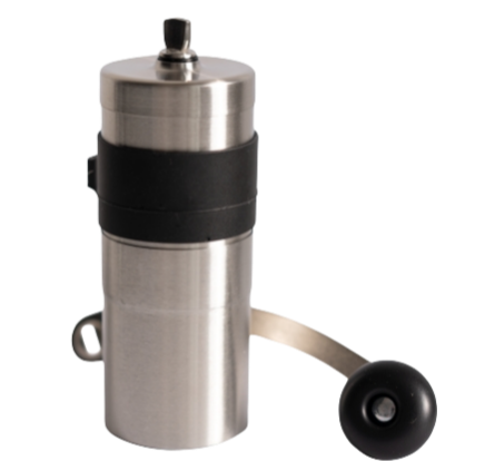 Manual coffee bean grinder with the handle beside it.