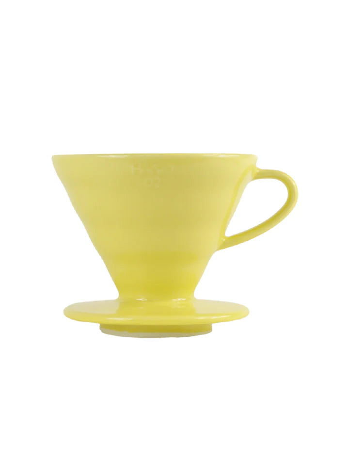 Yellow Hario V60-02 ceramic coffee dripper.